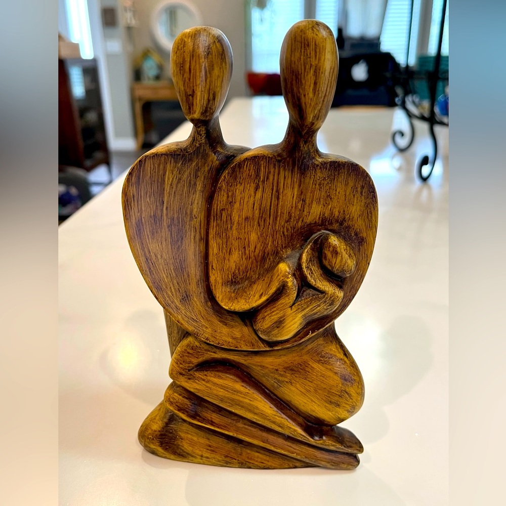 Wooden or strong resin sculpture of couple with baby